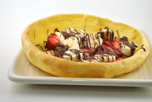 puffy pancake with strawberries and bananas