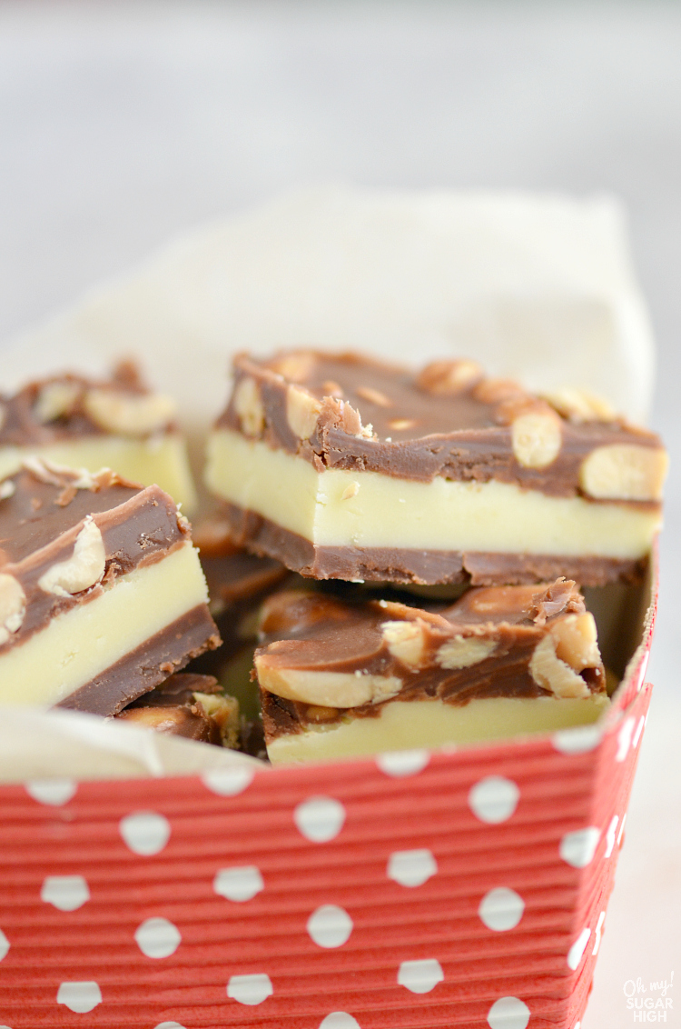 Homemade fudge recipe that is the best! This layered fudge features both chocolate and vanilla layers topped with peanuts!