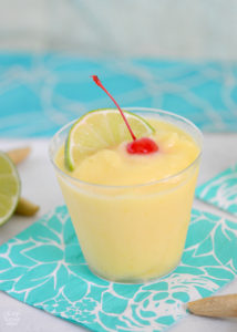 Cool off with this blended mocktail. This tropical non-alcoholic summer drink is perfect for all ages and includes mango, pineapple and coconut. Serve it at your next celebration including pool parties and summer cookouts.