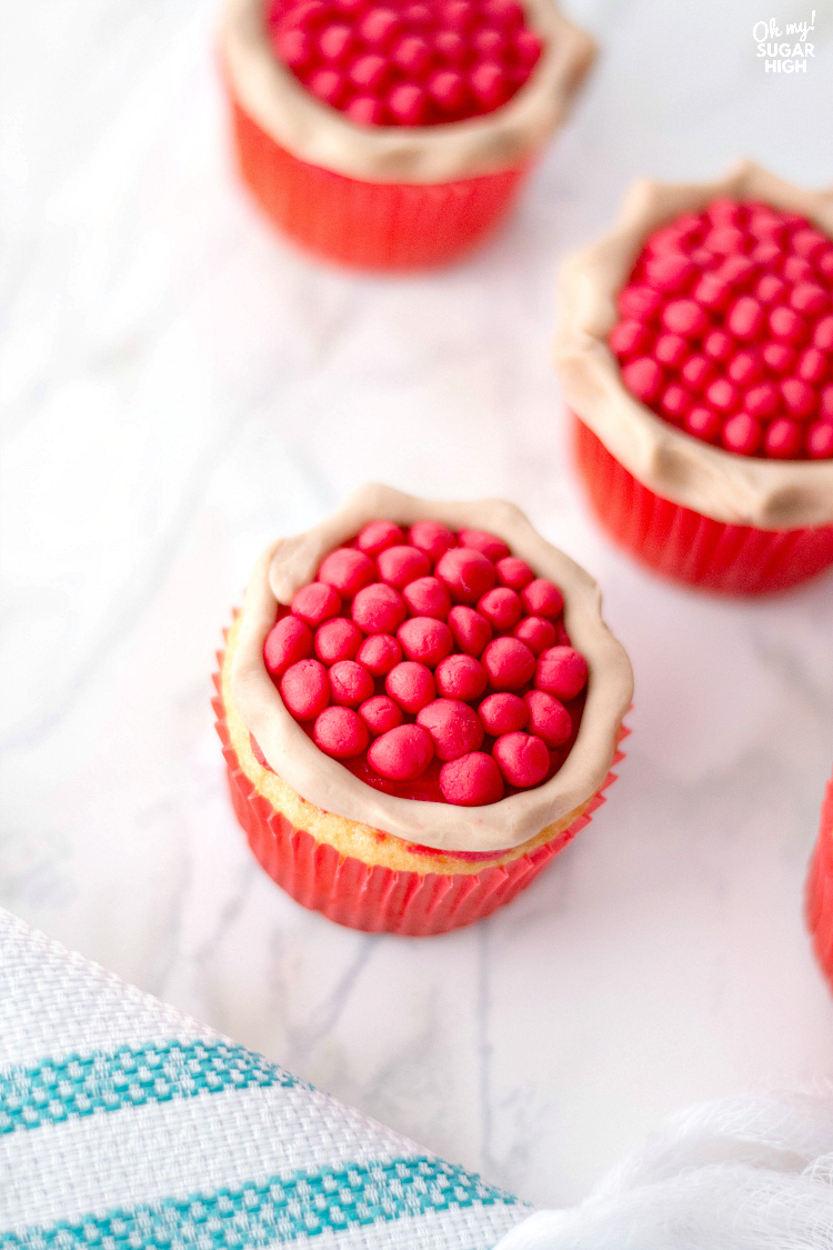 These cherry pie cupcakes are a show stopper at any summer cookout or Thanksgiving dessert table. Wow the crowd with these fun vanilla cupcakes that look like they have a cherry pie sitting on top! With just a few necessary ingredients, you'll be surprised how easy these cherry cupcakes are to make for any celebration.