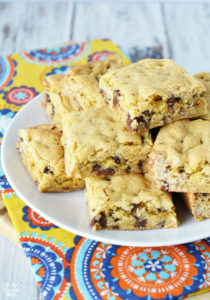 If you love soft cookies you'll love these chocolate chip cookie bars! These cookie bars made from a cake mix are dense, chewy and oh so delicious. You won't regret giving them a try!