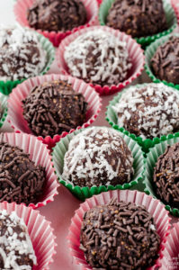 Chocolate rum balls are the perfect holiday indulgance! Made from graham cracker crumbs, this no make dessert is a great addition to your holiday gathering and easy to transport. Give this decadent confection a try!