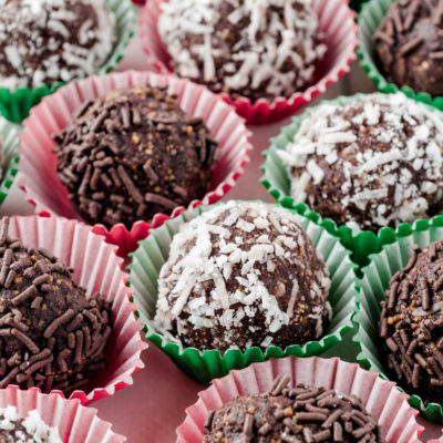 Chocolate rum balls are the perfect holiday indulgance! Made from graham cracker crumbs, this no make dessert is a great addition to your holiday gathering and easy to transport. Give this decadent confection a try!