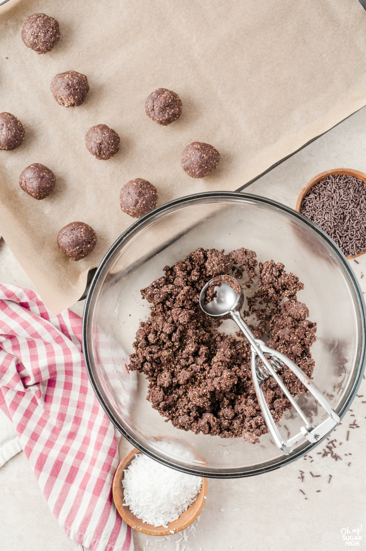 Using cookie scoop to make a round rum ball