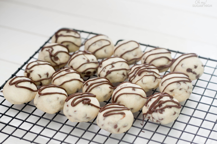 Chocolate Chip tea cookies on cooling rack with chocolate drizzle
