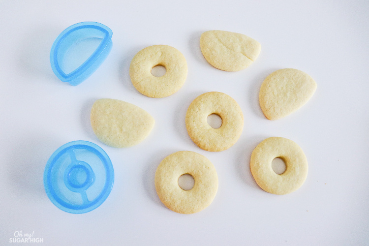 Using a donut cookie cutter to make life preserver sugar cookies
