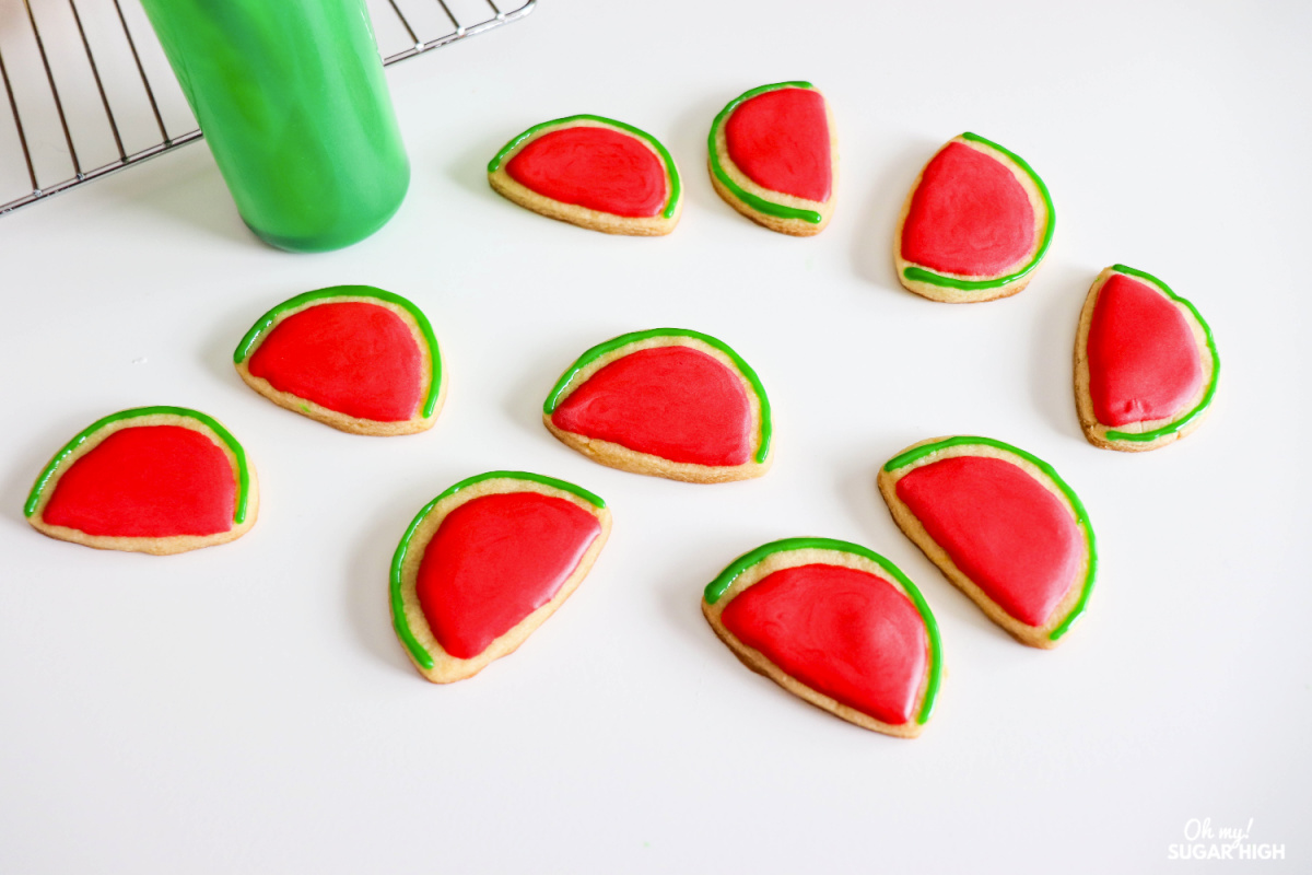 Using dark green icing for watermelon rind on a sugar cookie