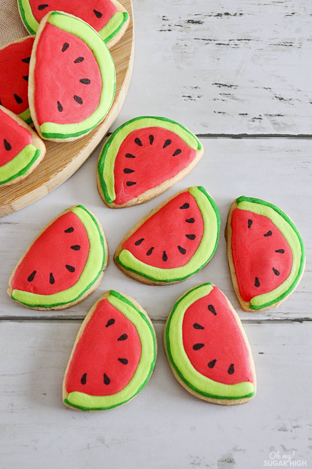 These fun watermelon sugar cookies are perfect for summer! They're sugar cookies with a royal icing watermelon design. Best of all they are easy to make and taste great, too. You can use pre-made refrigerated cookie dough for ease.